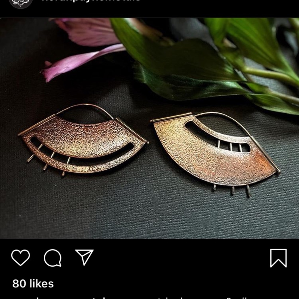 Asymmetrical copper and silver fans